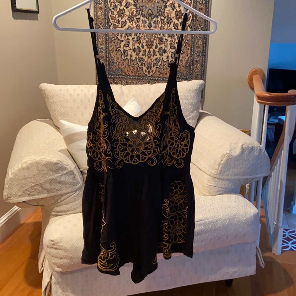 LF romper size XS but adjustable straps, zips up